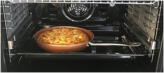 Copper pan in oven
